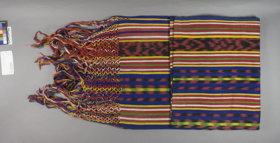 Hearst Museum object titled Shawl, accession number 16-20205, described as Shawl; 72 x 152 cm excluding fringe; 14 cm knotted warp; ca. 20 cm fringe, alternating vertical multicolored bands of stripes and ikat designs.