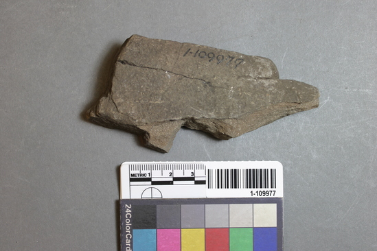 Hearst Museum object titled Abrader fragment, accession number 1-109977, described as Abrading stone fragment.