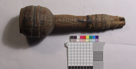 Hearst Museum object titled Pipe, accession number 16-7748, described as Pipe of jurema wood, incised line decorated stem and bowl, stem end has cord wrapped around it, length 4 1/4 inches