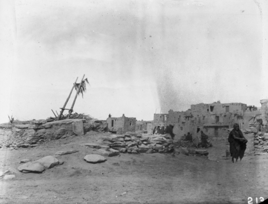 Hearst Museum object titled Black-and-white negative, accession number 15-213, described as Snake Kiva, closed; houses, Indian woman in foreground