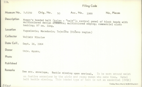 Documentation associated with Hearst Museum object titled Belt, accession number 7-5159, described as Woman's beaded belt (kolan - "belt"); central panel of black beads with multicolored design elements; multicolored edging; commercial cloth backing; 97 cm long