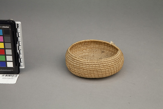 Hearst Museum object titled Basket, accession number 10-1313, described as Small basket, incurved, coiled; natural; flat bottom; 5”dia.