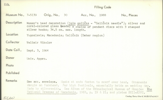 Documentation associated with Hearst Museum object titled Head decoration, accession number 7-5139, described as Women's head decoration (jgla galička - "Galičnik needle"); silver and coral-colored glass beads; 4 chains of pendant discs with 3 stamped silver hooks; 34.5 cm max. length