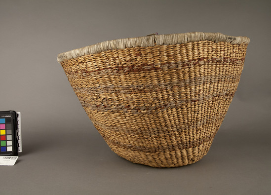 Hearst Museum object 2 of 2 titled Bowl basket, accession number 2-16746, described as Twine, of sumac, buckskin wrapping on rim; flaring bowl, inverted bottom.