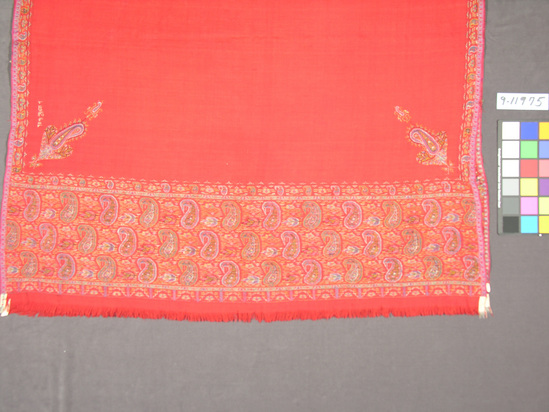 Hearst Museum object titled Shawl, accession number 9-11975, described as Shawl; Kashmir shawl; wool “twill tapestry” weave with varicolored floral and “pinecone” designs around border with additional embroidered designs inside border; red ground