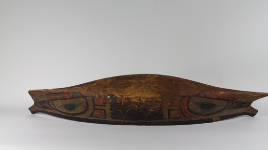 Hearst Museum object 4 of 6 titled Canoe model, accession number 2-10869, described as Model of canoe, painted totemic design in red, green, and black.  Wolf design (fide Charles Brown).