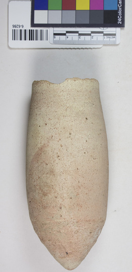 Hearst Museum object 5 of 5 titled Beer cup, accession number 6-6286, described as Pottery, deep pointed-bottomed buff cup, rim chipped: least diameter 5 cm, greatest diameter 6.5 cm, height 15 cm