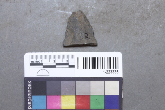 Hearst Museum object titled Projectile point, accession number 1-223335, described as Basalt point fragment