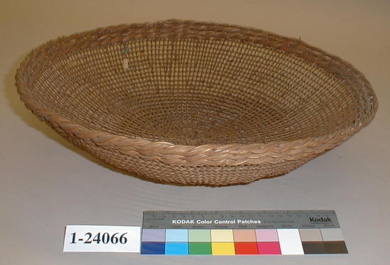 Hearst Museum object titled Basket, accession number 1-24066, described as Openwork twined basket.  3 heavy twisted bands around rim.