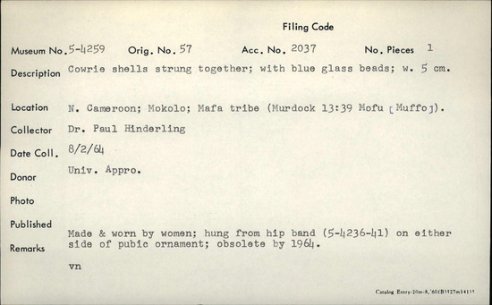Documentation associated with Hearst Museum object titled Shell and bead ornament, accession number 5-4259, described as Cowrie shells strung together; with blue glass beads; w. 5 cm.