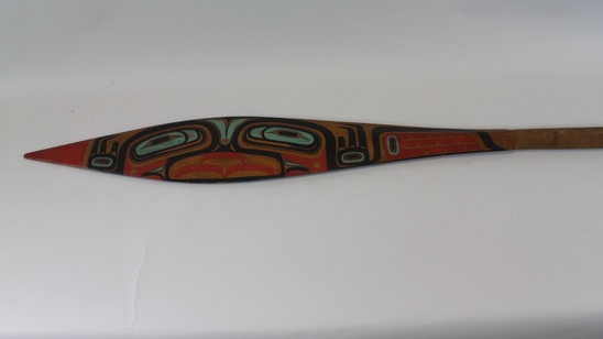 Hearst Museum object titled Paddle, accession number 2-30833, described as Canoe paddle, with painted totemic design in blue, red, and black.  Bird design: Charles Brown recognized bird design by 3 claws on feet.