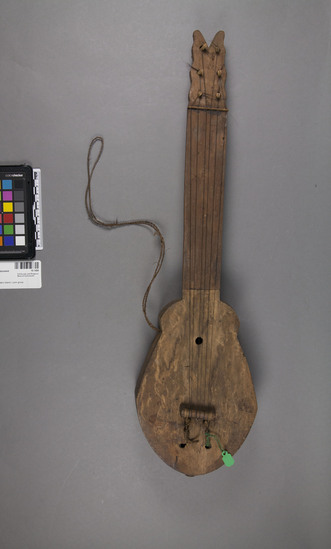 Hearst Museum object 4 of 4 titled Musical instrument, accession number 10-1458, described as Medium small guitar; 6 strings; 22 1/2” 1.