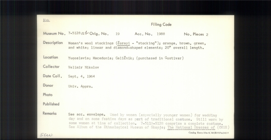 Documentation associated with Hearst Museum object titled Stocking, accession number 7-5128a,b, described as Woman's woll stockings (corapi - "stocking"); orange, brown, green, and white; linear and diamond-shpaed elements; 20"overall length.  Used by women (especially younger women) for wedding day and on some festive days as part of traditional costume. Still worn at time of collection, 1964. 7-5119-5128 comprise a complete costume.