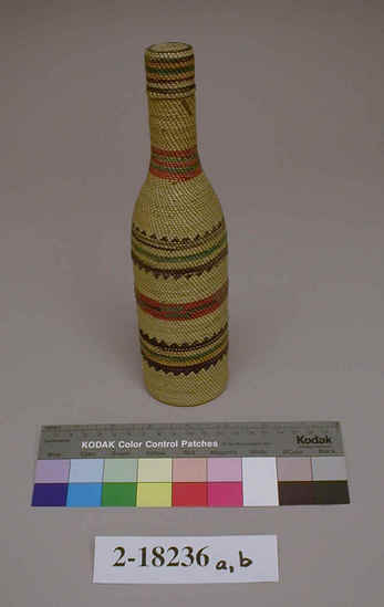 Hearst Museum object 1 of 3 titled Bottle, accession number 2-18236a,b, described as Glass bottle, twined basketry covered.