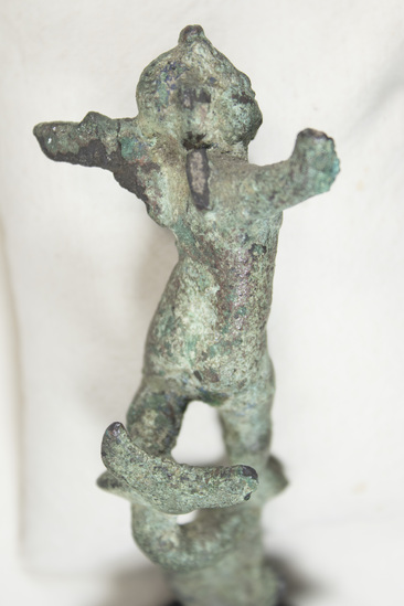 Hearst Museum object titled Cupid figurine, accession number 8-4598, described as Small bronze winged figure on dolphin; right forearm missing