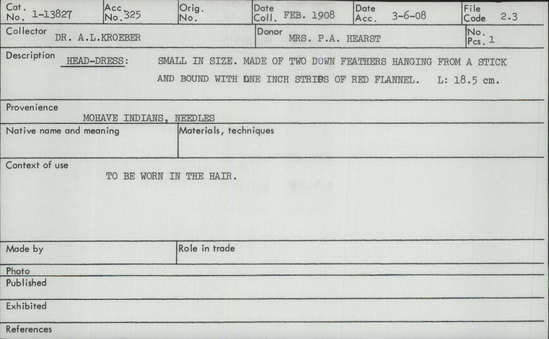 Documentation associated with Hearst Museum object titled Headdress, accession number 1-13827, described as Small in size.  Made of two down feathers hanging from a stick and bound with one inch strips of red flannel.