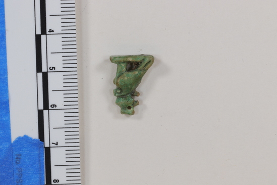 Hearst Museum object 9 of 13 titled Hawk amulet, accession number 6-22126, described as Amulet of hawk with one-handled peg on head; length 16 mm, greenish faience.