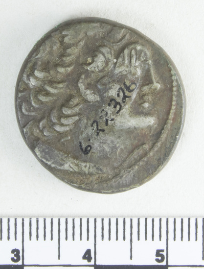 Hearst Museum object 5 of 10 titled Coin: billon tetradrachm, accession number 6-22326, described as Coin, silver base. Diameter 24 mm. Weight 13.25 grams. Condition good. Denomination: silver base tetradrachm. Obverse description: Head of Ptolemy I, facing right, diademed, aegis around neck, border of dots. Reverse description: [inscription] Eagle on thunderbolt, border of dots. Mint date: Alexandria, year 22, reign of Ptolemy XI, Alexander I.