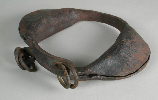 Hearst Museum object titled Amulet/ leg rattle, accession number 5-15424, described as amulet/ leg rattle;  iron leg rattle with two lobes containing rattling material; two iron rings attached to both ends; max W:  14.8 cm.