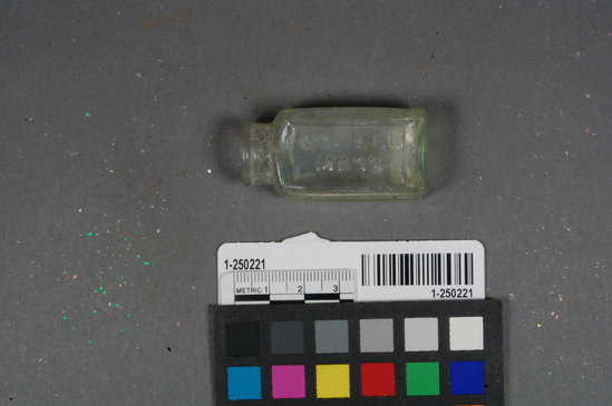 Hearst Museum object titled Bottle, accession number 1-250221, described as 3-part hinge mold light green embossed patent medical bottle with maker's mark