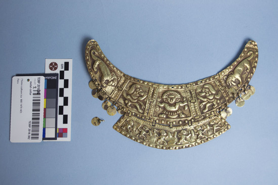 Hearst Museum object 1 of 3 titled Collar, accession number TEMP 2018.382, described as metal collar with thin round metal hanging from the sides; depictions of figures and animals