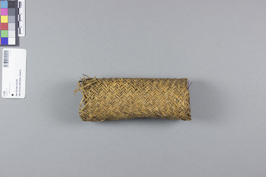 Hearst Museum object titled Wrist guard, accession number 11-933, described as Basketry wrist guard for bow.