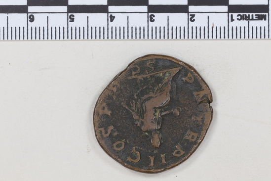 Hearst Museum object 7 of 8 titled Coin: æ sestertius, accession number 8-6243, described as Coin, Æ; Sestertius. 17.85 grams. Philippus Senior, 244-249 AD. Obverse: IMP M IVL PHILIPPVS AVG, Bust facing right, laureate, draped. Reverse: PM TRP II COS PP, SC in exergue, Emperor seated facing left on curule chair, holding globe in right hand and short scepter in left.