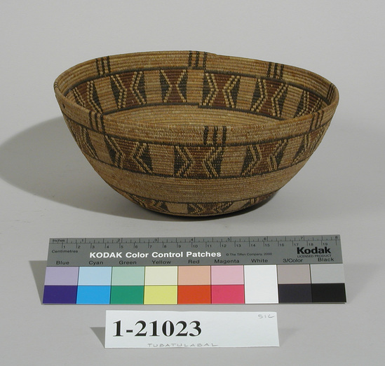 Hearst Museum object titled Bowl basket, accession number 1-21023, described as Bowl basket; twined. Warp is Epicampes (Sporobolus rigens), weft is Sedge (Carex). Red pattern is Yucca. White pattern is Redbud (Cercis occidentalis). Round, flat base, with 2 encircling bands enclosing butterfly pattern in black, white and red.