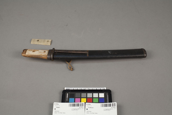 Hearst Museum object titled Dagger and scabbard, accession number 9-1979a,b, described as (A) Steel dagger, single-edged; (B) wooden scabbard