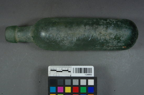 Hearst Museum object titled Bottle, accession number 1-249953, described as 2-part hinge mold light green embossed soda bottle