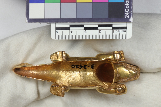 Hearst Museum object 3 of 6 titled Dog figurine, accession number 3-3420, described as Gold figurine of a dog.