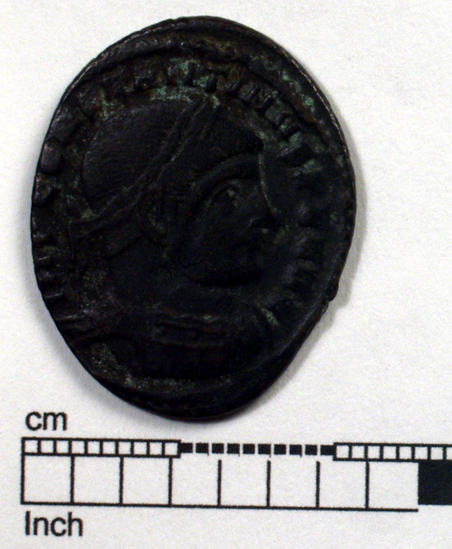 Hearst Museum object titled Coin: æ, accession number 8-5659, described as Coin. Roman. Æ. (    grams; 26 mm). Constantine I. AD. 312/313, Rome. Obverse: IMP CONSTANTINVS P F AVG   Bust facing right, laureate, cuirassed. Reverse: SOLI INVICTO COMITI   Sol standing facing left holding globe; in exergue, R Q.