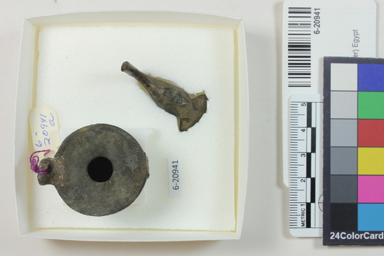 Hearst Museum object titled Oil lamp, accession number 6-20941, described as a) small bronze lamp b) fragment of bronze implement. Ptolemaic