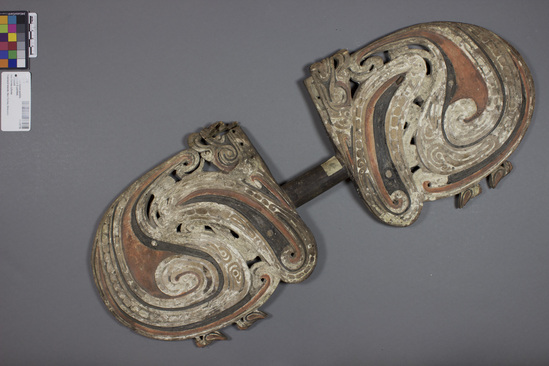 Hearst Museum object titled Dance paddle, accession number 11-39778, described as Shield, paddle-shaped, ornamental for dancing. Elaborate relief designs on both sides. Red, white, and black paint. Birds on margin. 62.1 cm length, 24.1 cm width