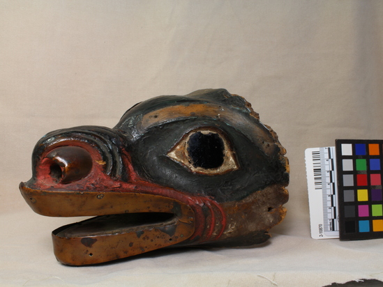 Hearst Museum object 5 of 9 titled Mask, accession number 2-10870, described as Bear head mask, decorated with strips of copper; dark brown glass eyes; wood painted black (?), red and white. Had fur cap attached, now long since destroyed by moths.