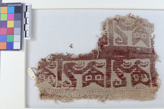 Hearst Museum object 2 of 4 titled Fragment of coarsely woven white pouch, accession number 16-984, described as Fragment of coarsely woven white pouch with red cat design