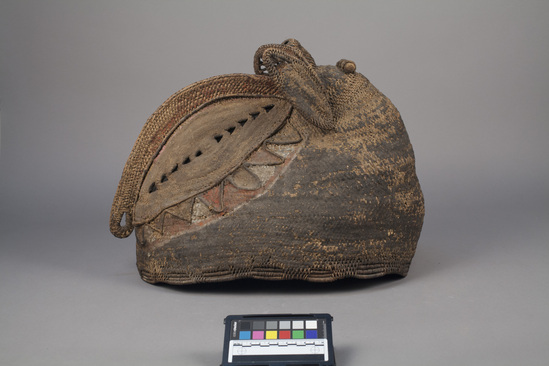 Hearst Museum object titled Mask, accession number 11-37362, described as Basketry bird mask; red, white, black. Mask of Baba-tagwa who puts ritual taboo on coconuts. 17 1/4 inches x 14 inches.