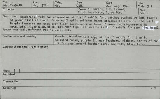 Documentation associated with Hearst Museum object titled Headdress, accession number 2-45410, described as Felt cap covered with strips of rabbit fur, patches stained yellow, traces of green fluff at front. Crown with 2 split polished horns attached to interior hide strip. Purple feathers and green-gray fluff in between and at base of horns. Multicolored silk grosgrain (?) ribbons bound to left horn tip. Ten "ermine tails" of rabbit fur sewn about a cord, red felt seized, with black hair tips; fringes at sides.