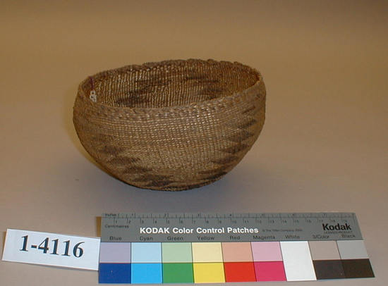 Hearst Museum object titled Cap, accession number 1-4116, described as Hat; twined. Warp is twisted Tule (Schoenoplectus acutus),weft is split Tule. White pattern is Reed (Phragmites vulgaris). Black color is mud-dyed split Tule.