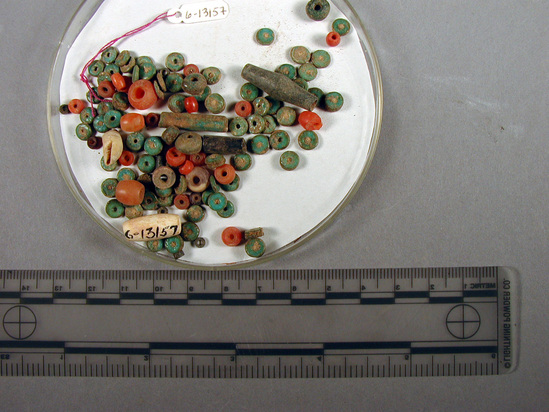 Hearst Museum object titled Beads, accession number 6-13157, described as Beads: carnelian, blue glaze, black stone, white shale, -- various shapes. [inv.: disc and cylinder beads]