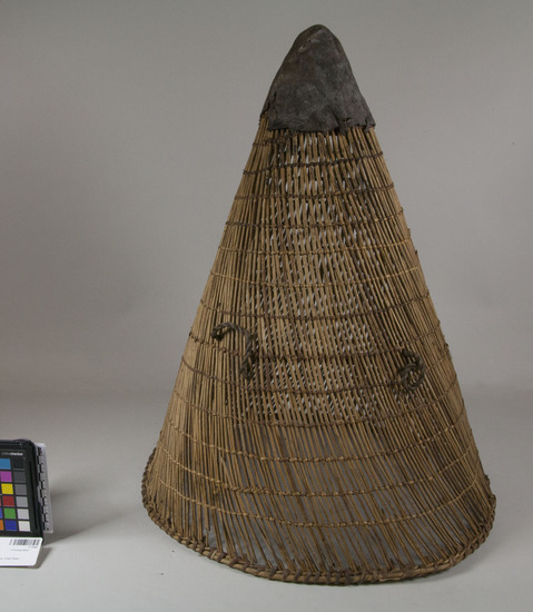 Hearst Museum object 2 of 3 titled Burden basket, accession number 1-71502, described as Burden basket, diagonal and some plain twined openwork, with two rope loops attached and reinforcing hoop about half-way down the basket. Basket point is reinforced in leather. Decoration: some of weft material is of a faint red color, as is stitching at rim, giving contrast. Design material is redbud.