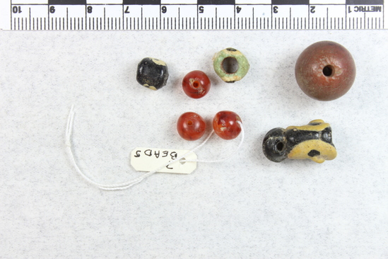 Hearst Museum object titled Beads, accession number 6-20944, described as beads, carnelian, brown, black. Middle Empire, New Empire, or Ptolemaic