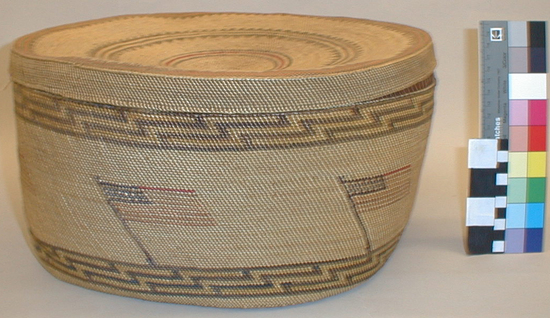 Hearst Museum object titled Basket and lid, accession number 2-33869a,b, described as a) Large wrapped-twined basket with b) lid; colored geometric band designs and American flags.