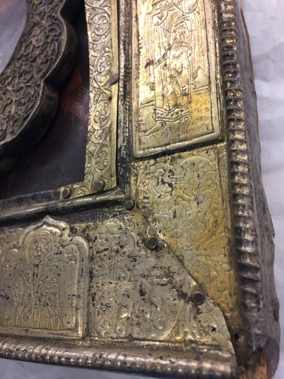 Hearst Museum object 6 of 49 titled Icon, accession number 7-3541, described as Icon of “Our lady of Vladmir”; Virgin and Child in tempera and gesso on wood; gilded silver basma; cloisonne halo with cloisonne collar pendant; halo has glass and amber (?) ornamentation; Virgin’s face damaged; height 30.2 cm, width 26 cm.