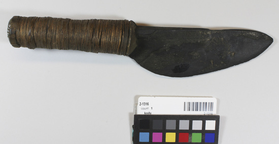 Hearst Museum object titled Knife, accession number 2-1316, described as Slate blade, single edged, wood handle with root wrappers.
