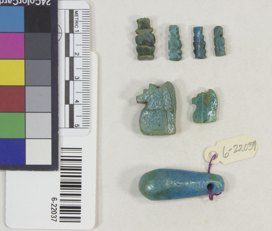 Hearst Museum object 11 of 22 titled Amulets, accession number 6-22037, described as amulets, of blue faience, and one pyramidal seal of steatite