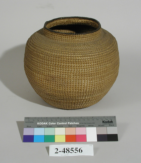 Hearst Museum object titled Basket, accession number 2-48556, described as Coiled, spherical with low neck. No decoration except black rim. Non-interlocking stitch; split cattail leaf bundle foundation, sewing in strands of cottonwood shoot and devil's claw material.