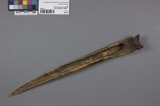 Hearst Museum object 2 of 4 titled Dagger, accession number 11-37560, described as Dagger, cassowary leg bone with designs carved in relief.