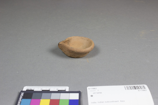 Hearst Museum object titled Oil lamp, accession number 9-11662, described as oil lamp with spout for wick. 6 cm