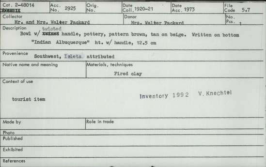 Documentation associated with Hearst Museum object titled Bowl, accession number 2-48014, described as With twisted handle. Pottery, pattern is brown, tan on biege. Written on bottom: "Indian Albuquerque". Made of fired clay.